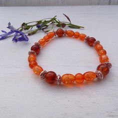 Check out this item in my Etsy shop https://www.etsy.com/listing/1112024423/orange-and-silver-stretch-bracelet Orange Stretch Bracelet With Large Beads As Gift, Handmade Orange Stretch Bracelet With Round Beads, Spiritual Orange Adjustable Beaded Bracelets, Spiritual Orange Beaded Bracelets With Faceted Beads, Amber Beaded Stretch Bracelet With Round Beads, Gift Orange Stretch Bracelet With Large Beads, Adjustable Orange Beaded Bracelets With 8mm Beads, Bohemian Stretch Bracelet With Colorful Beads, Orange Bohemian Beaded Bracelets With 8mm Beads