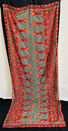 Phulkari hand-made multi-coloured thread Dupatta  shawl on a soft net material. Bordered edges and embroidery work all over the Dupatta.  Dupatta  shawl available in different colours. Perfect for Mehndi, weddings, party, and events. Great statement Dupatta/shawl for any outfit.  Please do not hesitate to contact us for any questions.  Please also visit our shop for more affordable Clothing and accessories. Embroidery Dupatta, Embroidery Work, Affordable Clothes, Dress Clothes For Women, Clothing And Accessories, Shawl, Hand Made, Multi Color, Dress Outfits