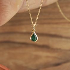 Handcrafted Pear Cut Emerald Pendant Necklace - Minimalist Lab Grown Gemstone Jewelry. Elegant Minimalist Lab Grown Emerald Pendant Necklace - Pear Cut Gemstone Jewelry Gemstone ✦ 𝗟𝗮𝗯 𝗚𝗿𝗼𝘄𝗻 / 𝗖𝗿𝗲𝗮𝘁𝗲𝗱 𝗘𝗺𝗲𝗿𝗮𝗹𝗱 - 𝗠𝗮𝗻 - 𝗠𝗮𝗱𝗲 ✦ Pear Cut -  ✦ Color -Green ✦ Excellent / Very Good Cut - Size (mm) : 3/4 mm (approx) ✦ Setting :  Bezel ✦ Bail -  3 mm Diameter Inside ✦ READY TO SHIP - GIFTS ✦ ( ONLY CHARM - PENDANT - SELECT CHAIN as per order ) Metal  ✦ Made of recycled 𝗦𝗼𝗹𝗶𝗱 𝗚𝗼𝗹𝗱 - Nickel free - 14k (585) ✦ Color - Yellow Gold - (as per order)  ✦ Weight-  0.400 Grams (Gold weight will vary as per order / Metal purity) ✦ Condition ➠ Brand New, Never been Used ✦ Send a message for Ring in Platinum Pt950 / ✦ Ring Available in Platinum Pt950 ✦ Stamp/Hallmark: Yes Con Teardrop Emerald Gemstone Necklace For Wedding, Teardrop Emerald Necklace For Wedding, Teardrop Emerald Wedding Necklace, Wedding Teardrop Emerald Necklace, Emerald Necklace In Yellow Gold For Weddings, Yellow Gold Emerald Necklace For Wedding, Wedding Emerald Necklace In Yellow Gold, Dainty 14k Gold Emerald Necklace For Anniversary, Gold 14k Gold Emerald Necklace For Wedding