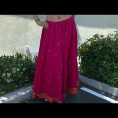 Designer. Unique Skirt For Women Of Today Add Class And Elegance. Stand Out In This Pink/Orange Long Skirt, Gold Details Overall, Pure Cotton Fabric For That Breathable Comfort . Wear It With Crop Tops, Bodysuits And Go On A New Adventure ! It Will Never Go Out Of Style. Size Fits Small To Large With The Tie String ! Traditional Harem Skirt For Festivals, Traditional Tiered Wrap Skirt For Festival, Bohemian Tiered Skirt For Festive Occasions, Festive Tiered Skirt, Festive Tiered Lined Skirt, Summer Bohemian Long Skirt Lehenga, Bohemian Flowy Skirt Bottoms For Festive Season, Festive Flared Skirt For Summer, Traditional Spring Lehenga Long Skirt