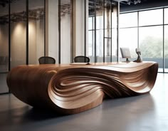 a wooden desk in an office with large windows