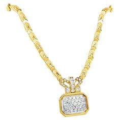 Retro 18k yellow gold diamond pendant necklace. This exquisite 18k yellow and white gold pendant necklace showcases a bold geometric design, expertly crafted with a fusion of Egyptian and Byzantine influences. The white gold pendant is framed in rich yellow gold, creating a striking contrast. It is set with 45 brilliant diamonds, totaling approximately 3 carats, adding a touch of sparkle and elegance. The pendant measures 1.25 inches in height and 7/8 inches in width, making it a versatile state 22k Gold Necklace Zales, Luxury 22k Gold Necklaces For Anniversary, Luxury Custom Yellow Gold Diamond Necklace, Gold Diamond Pendant Necklace, Vintage Chain Necklace, White Gold Pendant Necklace, White Gold Pendant, Egyptian Jewelry, Geometric Diamond