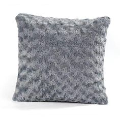 a gray and white pillow on a white background