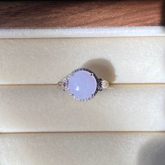 Ice Lavender Jade Ring, pinkish purple Jade Ring, 18K White Gold Jade Ring, Natural Grade A Burmese Jadeite Jade (18K金冰紫蛋面戒指)  ‼️Please contact us for the ring size‼️‼️ Color: Ice Lavender/Purple Jade Dimensions: 9.3×4mm Ring Size: 6.5（US) Material: 18k Rose Gold With Diamond  Genuine type A jade, 100% natural, No chemical bleaches and/or acids and impregnating. No artificially stained or dyed. Jade is a natural product that always has imperfections. These are considered to be part of the beauty and uniqueness of the jade stone. On different backgrounds, jade will show a bit different color, please take a look at the following detailed pictures, we promise these pictures are all photoed under sunlight indoor near a window without any edit. Purple Jade Ring, Purple Opal Promise Ring, Lavender Jade, Pinkish Purple, Ring Purple, Purple Jade, Star Chain, Purple Band, Jade Ring