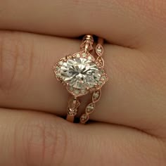 Oval Halo vintage look engagement ring in rose gold Vintage Moissanite Engagement Ring, Halo Top, Oval Halo Engagement Ring, Vintage Inspired Engagement Rings, Engagement Rings Vintage Halo, Diamond Engagement Rings Vintage, Types Of Diamonds, Oval Moissanite, Vintage Engagement Ring