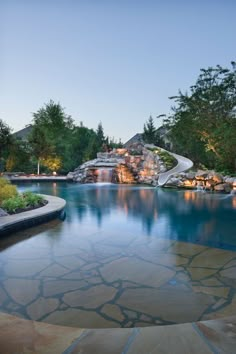 an instagram page with a pool and waterfall in the middle, surrounded by trees