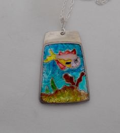 "Real cloisonné....I fired 7-10 layers of enamel into the fine silver cloisonné cells and then set the completed piece in sterling silver. The size is 1 1/4\" by 7/8\" and it has 18\" sterling silver chain. All my jewelry come in a nice gift box." Fish-shaped Enamel Jewelry As A Gift, Enamel Fish-shaped Jewelry As Gift, Enamel Fish-shaped Jewelry For Gifts, Fish-shaped Enamel Jewelry Gift, Fish-shaped Enamel Jewelry For Gifts, Handmade Silver Fish-shaped Necklace, Silver Enamel Necklace With Soldered Details, Silver Enamel Necklaces With Soldered Details, Unique Hand Painted Sterling Silver Necklace