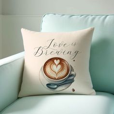 there is a pillow that has a cup of coffee on it and the words jello's brewing written in cursive writing