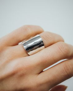 The Small Shield Ring is a sleek, armor-like statement piece with a refined, textured design. Slightly shorter than the Large Shield Ring, this ring offers a perfect balance of boldness and subtlety. Choose between the radiant Faceted Finish for a modern, geometric look or the textured Pebbled Finish for an organic feel. Its tapered shape ensures comfort while making a striking statement. Ideal for daily wear or as a standout addition to your jewelry collection, the Small Shield Ring complements Modern Hammered Adjustable Rings, Modern Sterling Silver Hammered Rings, Minimalist Sterling Silver Concave Ring, Sterling Silver Minimalist Ring, Unique Hammered Rings With Thick Band, Everyday Ring With Polished Edges, Unique Hammered Rings For Everyday Wear, Classic Hammered Open Ring Jewelry, Hand Forged Sterling Silver Rings With Thick Band