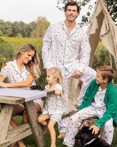 Wear your love of nature on your sleeve. Outdoor adventure meets cozy comfort with our new print featuring illustrations of classic camping scenes. Lush pine trees, pitch-perfect tents, glowing lanterns, and blazing bonfires against the backdrop of nature capture the essence of cherished family memories made around a campfire. This classic pajama set is accented with green piping and finished with pearl buttons. The fabric is made from 100% of the finest quality cotton. It is yarn-dyed to preven Christmas Pajamas Photoshoot Cordinating, Target Family Christmas Pajamas, Christmas Pajamas Photo With Snow, Matching Pajamas Family Christmas Photos, Family Christmas Pajamas Different, Chrostmas Pajamas Family, Holiday Cards Pictures Family Photos Pajamas, Chrismas Family Pajamas, Fun Family Pajamas