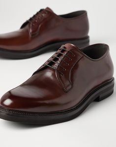 Cordovan Derbys Exquisite and timeless cordovan leather renews an iconic men's formal footwear design. Slight nuances of color enrich the leather's polished, even texture, while the silhouette of the upper and the thickness of the outsole are balanced to update the shoe’s classic aesthetic with a modern touch, in true Brunello Cucinelli style. Luxury Brown Derby Shoes For Semi-formal, Timeless Italian Oxfords For Semi-formal Occasions, Luxury Goodyear Welted Oxfords For Semi-formal Occasions, Timeless Brown Derby For Formal Occasions, Classic Italian Calf Leather Shoes, Classic Italian Leather Shoes, Luxury Brown Derby Shoes For Office, Luxury Goodyear Welted Dress Shoes For Formal Occasions, Timeless Italian Oxfords In Calf Leather