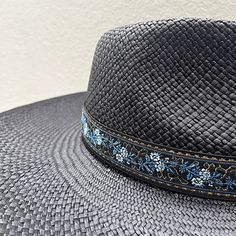 An elegant and highly versatile fashion statement, the Zoé straw fedora is designed with a teardrop crown and a large upturned brim, perfect for sun protection. Its versatility allows you to adjust the brim to your taste; up and curled up or down! It also features an adjustable sweatband to suit a variety of head sizes. Tall crown: 10cm | 3.94" Large brim: 12 cm | 4.72" Color: black UPF 50+ Handwoven in Ecuador Adjustable inner sweat band for added custom fit Elegant Adjustable Woven Hat Bands, Woven Straw Hat With Structured Crown, Woven Straw Hats With Structured Crown, Adjustable Straw Sun Hat With Structured Crown, Elegant Fedora With Curved Brim For Vacation, Adjustable Fedora Panama Hat For Garden Party, Adjustable Straw Panama Hat With Structured Crown, Summer Straw Hat With Structured Crown And Woven Detail, Adjustable Toquilla Straw Sun Hat With Structured Crown