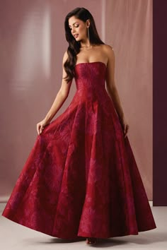 The Mimmy Gown will ensure you stand out from the crowd at your next formal function. This beautiful floral brocade number features a romantic strapless neckline and a voluminous floor-length A-line skirt. Wear this beauty to a red carpet event, gala, or your next special occasion. Red Formal Ball Gown, Dark Floral Prom Dress, Red Prom Dresses Poofy, Red Prom Dresses Long Elegant Classy, Hot Pink Formal Dresses, Red Prom Dresses Long Elegant, Champagne Problems Aesthetic, Hot Pink Gown, Short Sparkly Dresses