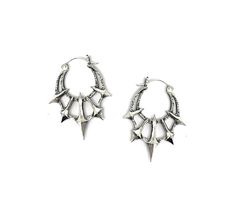 Add some gothic style to your wardrobe with these unique Chaos Earrings. Made in sterling silver, these earrings feature 5 spikes contrasted by a heavy textured crescent. Dimensions These earrings are 45mm long x 36mm wide and 5mm thick Each earring weighs approximately 6.5grams Festival Edgy Earrings For Pierced Ears, Edgy Silver Earrings For Festival, Silver Gothic Plug Earrings For Festival, Punk Style Silver Jewelry With Silver Studs, Edgy Silver Studs Jewelry, Silver Punk Jewelry With Spikes, Edgy Silver Jewelry With Spikes, Gothic Metal Jewelry With Spikes, Gothic Silver Earrings With Oxidized Finish