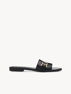 Chloé Marcie Slide | Chloé US Elegant Slip-on Sandals With Buckle Closure, Luxury Calf Leather Slides With Buckle Closure, Elegant Open Toe Slides With Buckle Closure, Elegant Leather Slides With Buckle Closure, Classic Slides With Removable Insole, Classic Flat Slides With Removable Insole, Classic Slip-on Sandals With Tang Buckle, Luxury Slide Mules With Leather Footbed, Elegant Formal Flat Slides