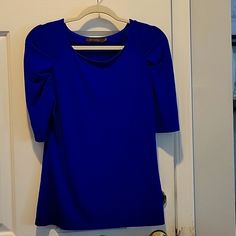 Beautiful Royal Blue Blouse With Pleated Sleeves Never Worn, No Stains, No Fabric Flaws 5% Spandex, Some Stretch But Fitted Stretch Elastane Solid Color Blouse, Blue Fitted Elastane Top, Fitted Blue Elastane Top, Fitted Blue Blouse For Office, Fitted Short Sleeve Elastane Blouse, Spring Short Sleeve Elastane Blouse, Chic Blue Stretch Blouse, Blue Stretch Blouse For Office, Stretch Blue Office Blouse