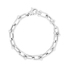 With a sleek and unique design, this silver link chain bracelet instantly elevates your attire. Hollow sterling silver Oval-shaped interlocking links with polished bead accents 9.2mm-wide chain 8.0 inches; lobster claw clasp Modern Oval Link Chain Bracelets, Modern Bracelets With Solid Chain Link Construction, Modern Solid Link Chain Bracelet, Everyday White Gold Sterling Silver Bracelet With Solid Link, Modern Chain Link Bracelet, Modern Solid Chain Link Bracelet, Modern White Gold Paperclip Bracelet, Modern Box Chain Bracelet With Oval Links, Modern Silver Link Chain Bracelet