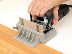 a person using a sanding machine on a wood floor