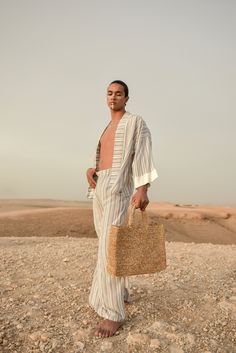 Do you want to look stylish and hippy? Get your hands on this handmade straw bag. It's high quality, eco-friendly, and handcrafted by women in Morocco. Its design is unique and timeless. Get yours now! we are proud to introduce our signature straw french bag to you. it is handmade by our talented artisan who has been working with us for years. this beautiful bag has a unique design that you would find nowhere else. the light and durable material are ideal for taking the bag on your adventures. S Bohemian Woven Straw Bag For Vacation, Handwoven Palm Leaf Beach Bag For Vacation, Vacation Handwoven Straw Bag Made Of Palm Leaf, Summer Travel Crochet Bag, Summer Travel Crochet Bag With Weaving Detail, Summer Travel Crochet Weaving Bag, Woven Straw Beach Bag For Day Out, Natural Woven Fabric Bags For Vacation, Natural Handwoven Bags For Day Out