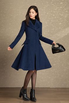 It is a princess coat in navy color. Navy has always been the most classic and mysterious color. Having a navy wool coat is essential for women. In the snowy winter, this long wool coat will make you look attractive to everyone.The  winter wool coat is a Unique design  and will let you shine wherever you go, perfect for every occasion.  ★★ FEATURES 50% wool blend, 50% fiber, nylon Polyester lining Two side pockets Invisible buckle wool coat Lapel collar wool coat Long sleeve wool coat Fit and flare wool coat Regular fit wool coat Mid calf wool coat Perfect for winter, autumn ★★ The model's height approx 170 cm (5′ 7″) with the 84 cm (33") bust, 66 cm (26") waist. She is wearing the wool coat in size XS (US2) ★★Bespoke Order Service Request other color Request the Length Request the sleeve Single Breasted A-line Outerwear For Work, Tailored A-line Outerwear For Winter, Tailored A-line Outerwear For Fall, A-line Single Breasted Outerwear For Work, Formal Knee-length Winter Outerwear, Winter Office Peacoat With Pockets, Business Knee-length Winter Outerwear, Tailored A-line Winter Outerwear, Knee-length Single Breasted Winter Outerwear