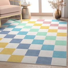 a multicolored area rug in a living room with a chair and vase on the floor