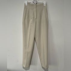 *Please Note Some Dirty Spots* High Waisted Pants With Pronounced Seams At Front And Back. Front Welt Pockets. Front Zip, Metal Hook, And Inside Button Closure. Oyster White Xs Beige Fitted Tapered Leg Bottoms, Cream Straight Pants With Belt Loops, Fitted Beige Tapered Leg Bottoms, Cream Trousers For Office Wear, Cream Trousers For Office, Classic Fitted Neutral Bottoms, Cream High Waist Stretch Pants, High Waist Stretch Cream Pants, Cream Color High Waist Stretch Pants