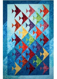 an image of a quilt with fish on the front and back side, all in different colors