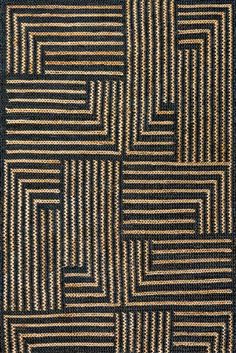 a black and brown rug with squares on it