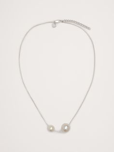 Asymmetric necklace with a duo of pearl accents finished in 999-silver plated brass.  Lobster clasp.  Length: 28" with 2" adjuster. Asymmetric Necklace, Pearl Necklace Silver, Work Capsule, Silver Pearl Necklace, Necklace Silver, Lobster Clasp, Women's Accessories, Silver Plate, Pearl Necklace