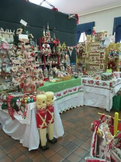 a room filled with lots of different types of christmas decorations and ornaments on display in it