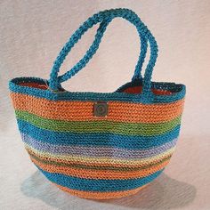 The Perfect Companion for Sunny Days ☀️️ Elevate your style with our handmade crochet tote bag made from natural paper yarn!  Perfect for the beach, picnics, or everyday use, this stylish bag is both lightweight and durable. Its spacious interior allows you to carry your personal belongings and small snacks with ease. A wonderful gift option to make your loved ones happy on special occasions!  Whether it's Mother's Day or Valentine's Day, show your love with this meaningful present. ❤️ Features: Bohemian Bucket Bag For Beach, Bohemian Multicolor Bucket Bag For Beach, Multicolor Jute Shoulder Bag For Beach, Bohemian Bucket Beach Bag, Bohemian Crochet Bucket Bag For Travel, Multicolor Hobo Tote Bag For Beach, Handmade Multicolor Hobo Bag, Multicolor Hobo Bag With Braided Handles For Beach, Multicolor Hobo Bag With Adjustable Strap For Beach