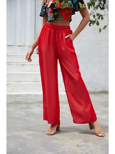 The EMES SHOP pants are detailed with a fun drawstring waist detail that is easily adjustable for your comfort. Features a palazzo style silhouette. solid color. and slant pockets. Style it with a halter cropped top for a dazzling look this season.MATERIAL:100% Soft Poly MEASUREMENTS:Trousers length 40"-42"in Small |Waist: 26"-28"in |Hip: 38"-40"in Medium|Waist: 28"-30"in |Hip: 40"-42"in Large|Waist: 30"-32"in |Hip: 42"-44"in XL |Waist: 32"-34"in |Hip: 44"-46"in High Waist Drawstring Vacation Pants, High Waist Drawstring Pants For Vacation, Bohemian Solid Color Summer Bottoms, Bohemian Summer Bottoms In Solid Color, Solid Color Drawstring Harem Pants For Summer, High-waisted Drawstring Pants For Vacation, Solid Rayon Beach Bottoms, Summer Harem Pants With Drawstring, Bohemian Summer Pants In Solid Color