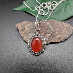 "Visit our on-line shop at: Etsy.com/shop/AlbuquerqueDesigns *sterling silver necklace pendant *Small pendant with silver box chain necklace 18\" *southwestern jewelry *carnelian / healing carnelian *calibrated pre-cut stones: 10x14mm oval shape *back of jewelry items are all covered / do not show the back of stones *all jewelry items are made to ship, slight variations in stones will occur comparing to pictures. *size of a penny is 19mm or a dime is 18mm in diameter for comparing size with jewe Carnelian Oval Pendant Necklace As A Gift, Vintage Carnelian Necklace As Gift, Stamped 925 Carnelian Jewelry, Carnelian Oval Pendant Necklace For Gift, Vintage Carnelian Necklace For Gift, Vintage Carnelian Necklace For Gifts, Classic Silver Carnelian Jewelry, Vintage Carnelian Necklace Gift, Spiritual Silver Carnelian Necklace