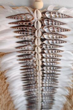 the back of a woman's dress made out of feathers