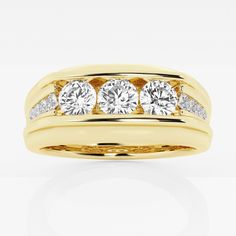 a yellow gold ring with three diamonds