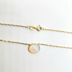 Purity- 18kt Gold Color- Yellow Gold Stone - Genuine Opal Stone Shape - Oval Size Of Stone Design-8mm X 30mm Formal Opal Round Necklace, Gold Opal Jewelry With Round Cut, Formal Round Opal Necklace, Elegant Yellow Gold Opal Jewelry, Yellow Gold Round Opal Jewelry, Tarnish Resistant Opal Jewelry In Yellow Gold, Fine Jewelry Opal In Yellow Gold, 14k Yellow Gold Necklace With Bezel Setting, Yellow Gold Opal Necklace For Anniversary