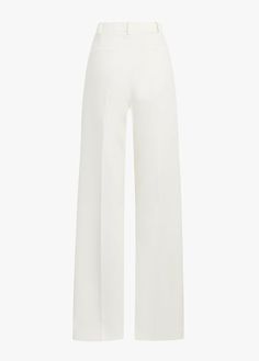 The Low Favorite Pant is our best-selling mid-rise trouser (formerly The Agnes Pant), cast in a structured Italian suiting fabric. With a fluid wide-leg silhouette and front pleats, these classic ivory pants are a true wardrobe essential.74% Polyester 20% Rayon 6% SpandexCare Instructions:Machine wash cold gentle cycleLine dryDry CleanMegan is 5'10" wearing size 2Rise: 11 1/2"Leg Opening: 21"Inseam: 34" Tailored White Wide Leg Pants With Pressed Crease, White High-waisted Wide Leg Pants With Pressed Crease, Formal Wide-leg Pants With Structured Boning, White Straight Leg Bottoms With Pressed Crease, White Wide-leg Bottoms With Pressed Crease, White Wide Leg Pants With Pressed Crease For Work, White Pants With Pressed Crease For Work, White Pressed Crease Pants For Work, Tailored White Pants With Pressed Crease