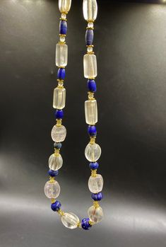 The Beautiful Necklace Of Crystals Quartz Beads Probably From Ancient Historic Civilizations The Origin Is From Central Asian Countries Some Lapis and Brass Beads Are Used As Spacers In The Necklace Conditions Of Beads Are Clearly Shown In The Pictures Very Attractive Skin Of This Beads Handmade Elegant Rondelle Beads, Elegant Handmade Rondelle Beads, Elegant Beaded Crystal Necklace With Oval Beads, Elegant Handmade Beads Gems And Cabochons For Healing, Elegant Rondelle Beads With Natural Stones, Elegant Beaded Necklaces With Large Beads For Healing, Elegant Rondelle Beaded Necklaces With Large Beads, Elegant Necklaces With Oval Beads For Healing, Formal Oval Gemstone Beaded Necklaces