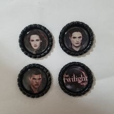 three badges with the twilight saga on them