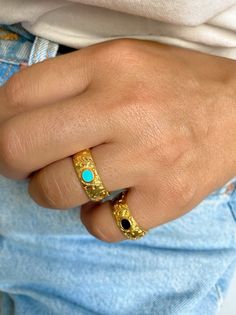 Two different handmade rings in gold color. Both of them have floral shape as designs and an oval enamel stone at the center. The first one is black and the second one is turquoise. Both of them are slightly adjustable. In Christina Christi Jewels store you can see a lot of designs in Women's Rings. You can have them in 2-4 Days with DHL EXPRESS SHIPPING DIMENSIONS - Rings Diameter is 17mm (0.67'') - US 7 - Floral Ring: 22x21 mm (0.86x0.82) - Slightly Adjustable. MATERIALS - Gold Plated 24k Pewt Gold Turquoise Open Ring As A Gift, Adjustable Gold Turquoise Ring With Oval Shape, Adjustable Gold Oval Turquoise Ring, Gold Turquoise Ring For Gift, Gold Turquoise Ring Gift, Gold Enamel Open Ring Jewelry, Gold Enamel Ring For A Gift, Gold Enamel Ring Perfect For Gift, Unique Gold Enamel Ring With Gemstone