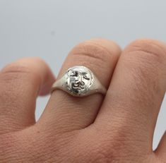 Moonface signet ring for women or for men. Size: made to order, please check your size with a proper jewelry tool or in a jewelry store. This ring is made in silver 925.  You can find some other rings from the same collection here:  https://www.etsy.com/listing/888180722/moon-face-ring-signet-unisex-ring?ref=shop_home_active_35&frs=1 The face necklace : https://www.etsy.com/listing/900846011/silver-face-pendant-moon-necklace?ref=shop_home_active_4&pro=1&frs=1 This ring is available also in 18K gold. Depending on your size, the price will be between 732- 850 euros. Don't hesitate to contact me. Jewelry Tool, Blue Aquamarine Ring, Face Ring, Man Ring, Face Necklace, Moon Face, Small Faces, Aquamarine Rings, Unisex Ring