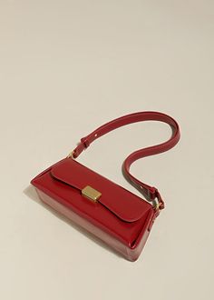 Indulge in sophistication and style with our Red Leather Baguette Shoulder Bag. The flap lock closure and adjustable strap combine practicality with elegance. The structured silhouette and flat base provide stability, while the interior slip pockets enhance organization. Handcrafted with genuine cowhide leather, this women's shoulder bag is the epitome of luxury. Size info 11" (28cm) width 4"(10cm) height 6 3/4"(17cm) depth Details Flap lock closure Adjustable shoulder strap Structured silhouett Modern Red Rectangular Flap Bag, Leather Baguette Bag With Magnetic Closure For Office, Luxury Red Shoulder Bag With Turn-lock Closure, Square Baguette Bag With Hasp Closure For Office, Classic Satchel Baguette Bag For Business, Evening Rectangular Baguette Bag With Magnetic Closure, Elegant Leather Baguette Bag With Magnetic Closure, Classic Baguette Bag For Daily Use, Rectangular Evening Baguette Bag With Magnetic Closure