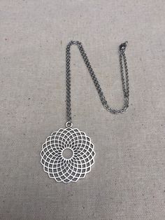 "This is such a fun and funky big mandala necklace! It is eye catching and mesmerizing. Make a statement without saying a word with this bold geometric piece. The mandala measure 2 1/8\" long by 2\" wide and hangs from a simple 18\" stainless steel necklace chain with a lobster clasp. I have matching earrings in my shop, if you would like the whole set. Here is the link https://etsy.me/2A1RuZW Thanks for stopping by! Please take a moment and visit the rest of my Etsy shop. I have many more uniqu Nickel Free Metal Necklaces, Nickel-free Circular Metal Necklace, Bohemian Stainless Steel Nickel Free Necklaces, Bohemian Circle Metal Necklace, Bohemian Adjustable Stainless Steel Necklaces, Adjustable Bohemian Stainless Steel Necklaces, Silver Geometric Metal Necklace, Nickel Free Metal Medallion Necklace For Gift, Bohemian Geometric Nickel-free Jewelry