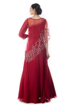 Maroon bead and cutdana embroidered cutwork cape gown with asymmetric sleeves.
Components: 1
Pattern: Embroidered
Type Of Work: Sequin, Cutdana
Neckline: Round
Sleeve Type: Asymmetric
Fabric: Georgette, Net
Color: Maroon
Other Details: 
Attached tafetta lining
Gown Length: 60 inches
Disclaimer: Possibility of slight color variation
Occasion: Reception, Sangeet - Aza Fashions Embroidered Cape, Georgette Gown, Cape Gown, Gown For Women, Ladies Gown, Gowns Online, Cut Work, Aza Fashion, One Shoulder Formal Dress