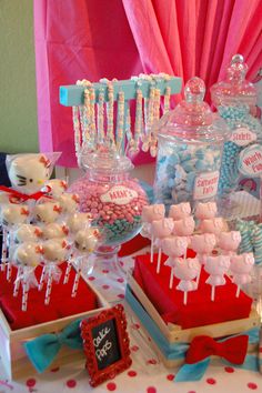 a table topped with lots of candy and candies