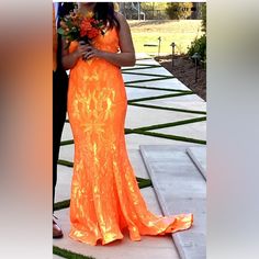 Jovani Orange 3263 Sequin Sheath 2022 Prom Dress Size 8 Petite Worn Once Neon. This Dress Was Professionally Altered (Hemmed) For A 5'2 Girl Wearing 3 Inch Wedge Heels. Nothing Else Was Altered. Train Is Intact. This Fits Almost All Body Types Like A Glove As It Has Some Stretch. Has Built In Pads In The Busy Area. Zip And Eye Hook In The Back. Not Only Drop Dead Gorgeous But Is Comfy! Hem Has Some Stiffness To It So It Keeps Its Shape. The Under Slip Was Not Hemmed Just Raw Edge. Ask For More Pics If Needed. I Ship Within 24 Hours 2022 Prom Dress, Jovani Dresses, Eye Hook, 2 Girl, Neon Color, All Body Types, Girls Wear, Raw Edge, Wedge Heels