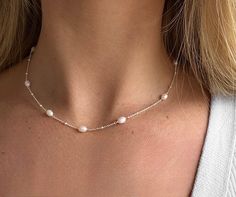 Our dainty beaded freshwater Pearl necklace is the perfect accessory for your everyday look. Layer with different sized necklace chains or wear on its own.  pair with our matching bracelet.  choose 925 Sterling silver and freshwater pearls or yellow gold plated with freshwater pearls Chain length- 41 + 6cm with extender chain.  Width- 4mm Depth- 4mm All orders are beautifully packaged in our SophieJean gift bags, perfect for gifting or as a special treat for yourself 🤍 Dainty Silver Beaded Necklace With Pearl Chain, Dainty Pearl Beaded Necklaces In Silver, Dainty Silver Pearl Beaded Necklaces, Dainty Silver Pearl Beaded Necklace, Delicate Silver Beaded Necklace With Pearl Charm, Dainty Pearl White Beaded Necklaces, Delicate Sterling Silver Pearl Necklace With Delicate Chain, Delicate Silver Beaded Necklace With Pearl Drop, Silver Dainty Pearl Necklace