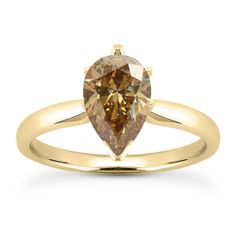 a yellow gold ring with a pear shaped brown diamond in the center, on a white background