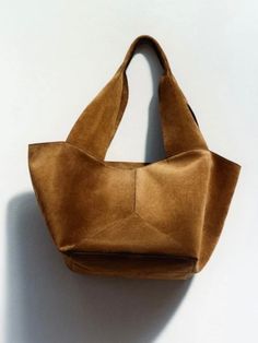 Casual style. Lightweight. Faux suede. Measurements are 50 cms. Length (19.68” inches) x 40 cms height (15.74” inches) x 15 cms width (5.9” inches). Color may be lighter or darker depending of the device it is displayed. Modern Suede Shoulder Bag For On-the-go, Chic Suede Bag For On-the-go, Modern Double Handle Suede Hobo Bag, Modern Suede Hobo Bag With Double Handle, Chic Tote Shoulder Bag With Suede Lining, Chic Double Handle Shoulder Bag With Suede Lining, Chic Shoulder Bag With Suede Lining And Double Handle, Elegant Brown Suede Satchel, Daily Use Suede Satchel With Suede Lining