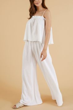 Walk into your day with our soft and light-weighted cotton Skye Palazzo Pants White, designed to make you feel confident and relaxed throughout your day. Feel at your best silhouette with these loose-fitting lounge pants featured with elasticated high waist to accentuate your natural waist. - 100% Turkish cotton- One size fits most- Elasticated waist Cotton Pants For Summer Relaxation, Summer Cotton Pants For Relaxation, Relaxed Pants For Spring Relaxation, Cotton High-waisted Lounge Pants, High-waisted Cotton Lounging Pants, High-waisted Cotton Lounge Pants, High-waisted Cotton Pants For Lounging, Spring Wide Leg Pants For Relaxation, Chic Cotton Wide Leg Pants For Lounging